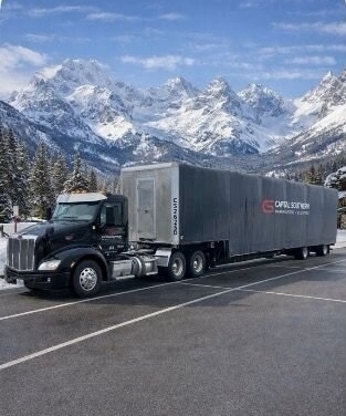 Capital Southern truck driving through mountain scape